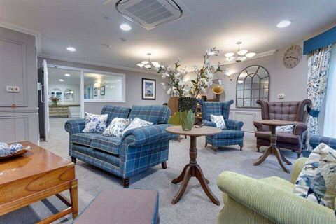 Care home lounge with blue furniture 